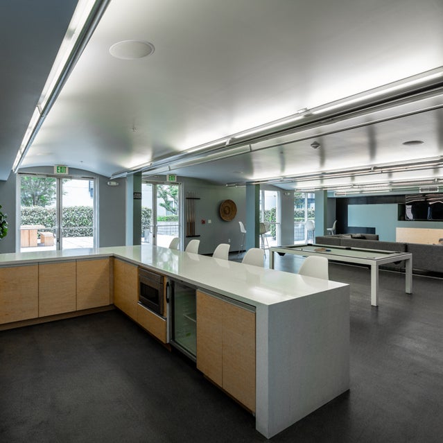 Domain Oakland Apartments - clubhouse with cooking area, games and entertainment area