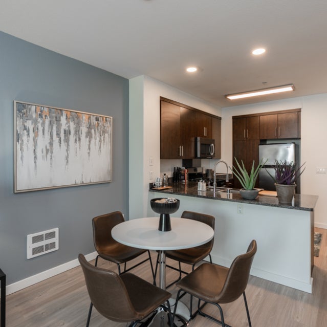 Domain Oakland Apartments - dining room in apartment home next to breakfast buffet