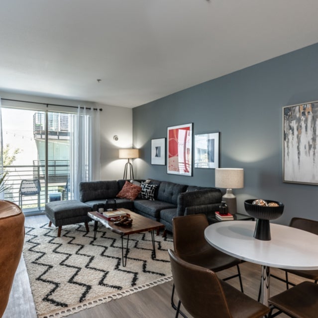 Domain Oakland Apartments - carpeted living room