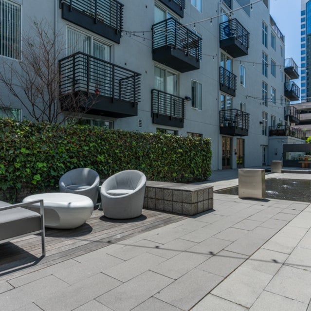 Domain Oakland Apartments - courtyard with lounge seating and firepits