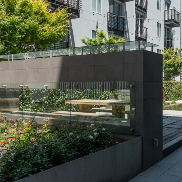 Domain Oakland Apartments - courtyard plants and firepit